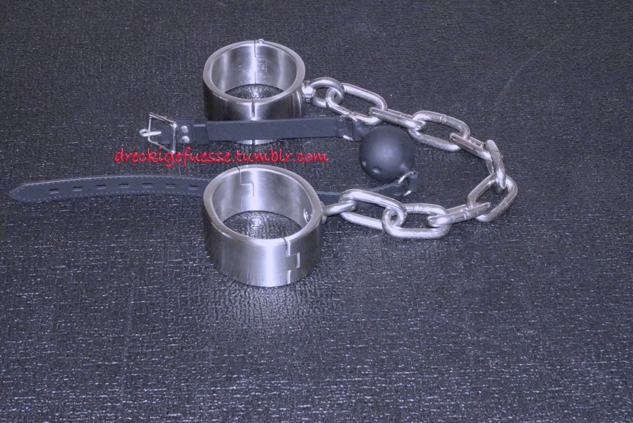 dreckigefuesse: Handcuffs hanging from the ceiling and the heavy shackles together