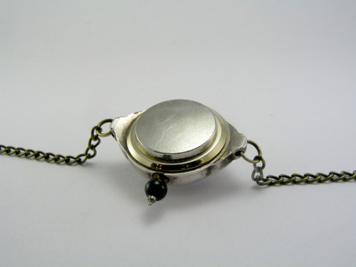 My latest piece, a necklace made in a small vintage wristwatch case. Inside is a tiny scene where a 