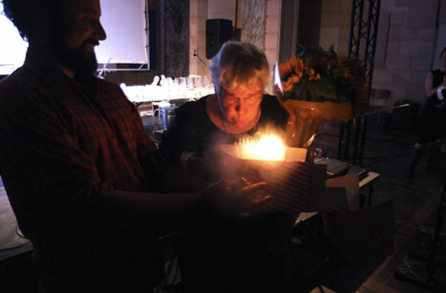 Pauline Oliveros blowing out her birthday candles.