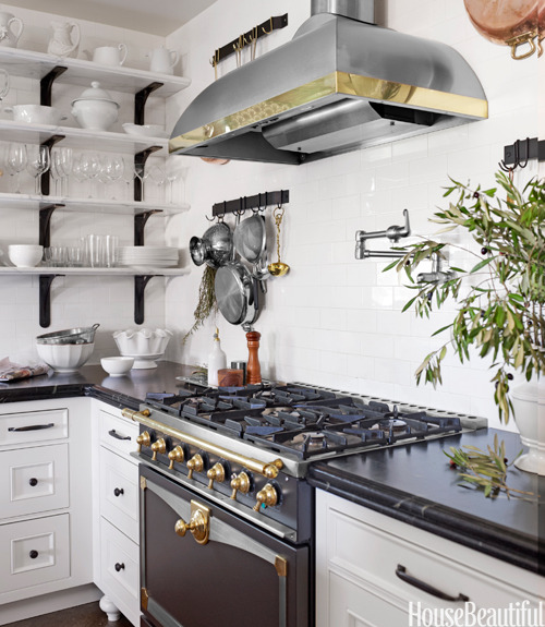 {Some lunch-time inspiration - a Monday Mix of kitchens with beautiful black ranges…}