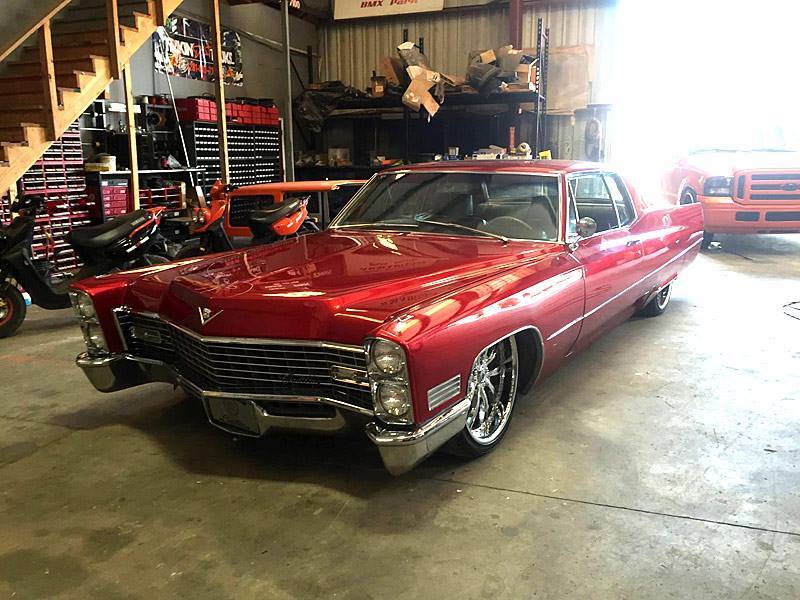 belcolor:    Candy Red Caddilac DeVille on 22’’ Asanti wheels   