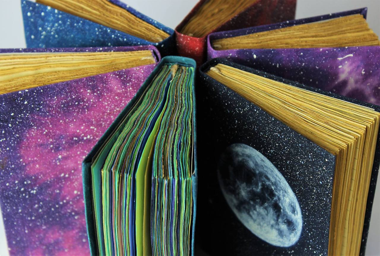 rollingpenguin: sosuperawesome:  Handmade Batik Fabric Cosmos Journals and Notebooks
