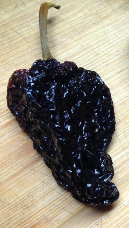 Ancho Chile Peppers Ripened to red, dehydrated, seeded and stemmed, and cast iron roasted. Fresh gro