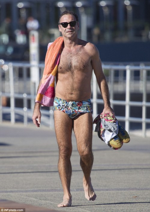 bizarrecelebnudes:  Andrew O’Keefe - Aussie Tv Presenter (Part 1) Love him. He always loves showing of in speedos by the beach. Love his hairy body. 