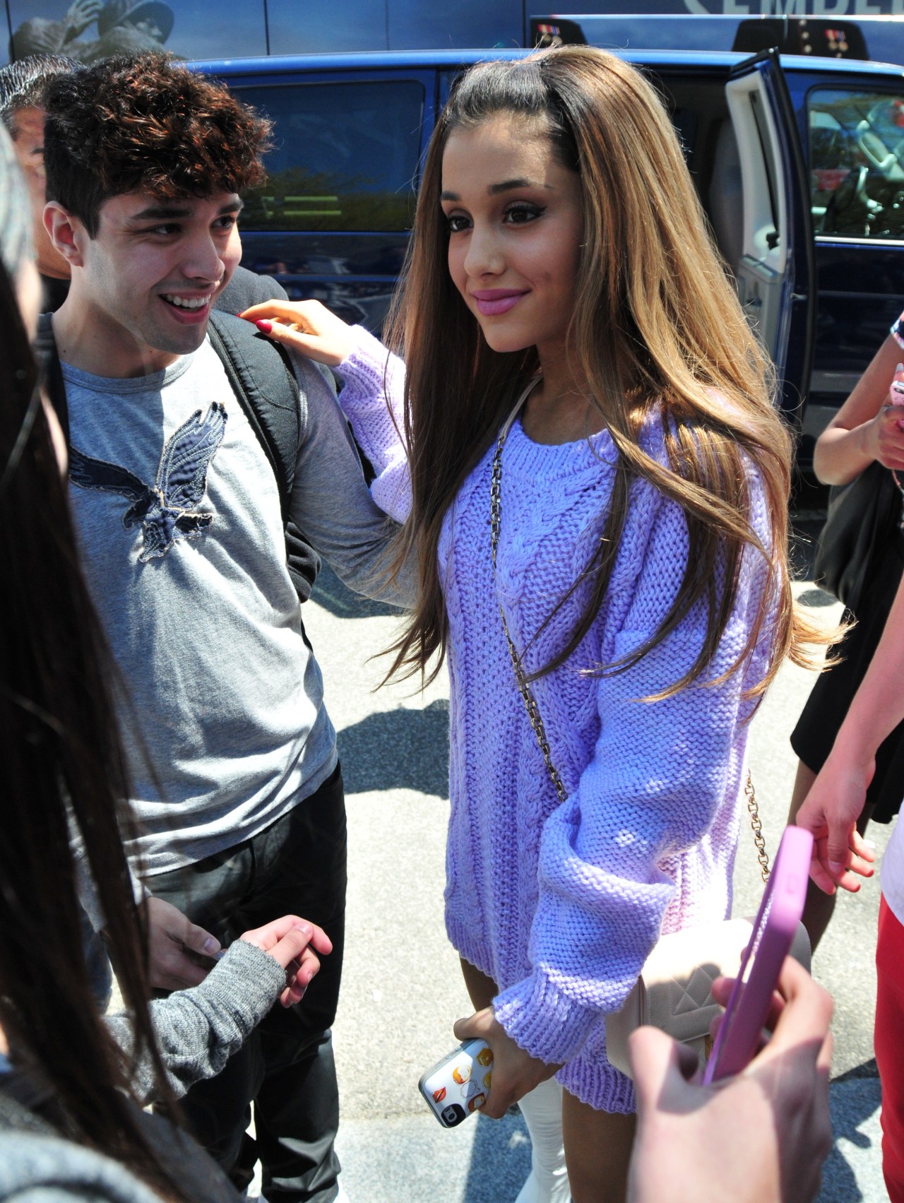 Ariana Grande. ♥  Cute and sexy in a purple sweater and white go go boots combination.