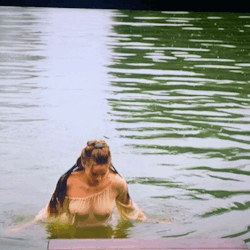  Noémie Schmidt (as Henriette of England) emerging from a pond wearing  nothing but a very thin  undergarment that is completely see-through and clings to her body while  wet. - From: Versailles (2015- ), a television series, set during the  construction