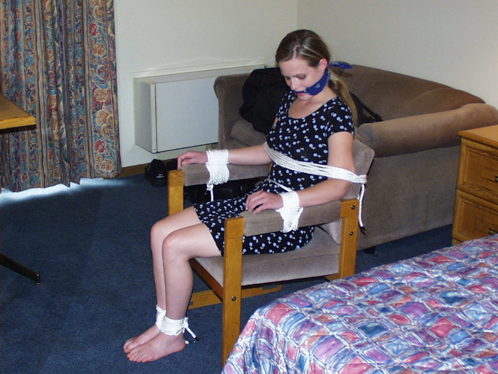 graybandanna:  Tied to a chair with a big blue bandanna gag 