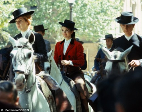 The Duchess of Alba and Jackie Kennedy sporting traditional Andalusian riding outfits, during the Ke