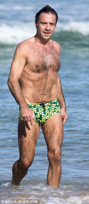 bizarrecelebnudes:  Andrew O’Keefe - Aussie Tv Presenter (Part 1) Love him. He always loves showing of in speedos by the beach. Love his hairy body. 