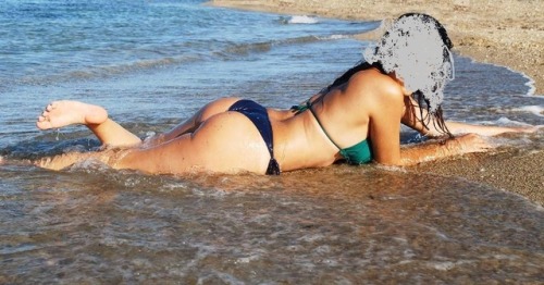 A photo from our vacation! Me posing on the beach, hubby staring at what he cannot enjoy anymore. I 