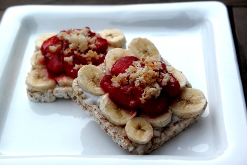 spelt cakes topped with coconut agave glaze, banana slices, strawberries and agave roasted coconut s