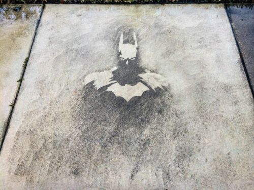 seraphica:  A growing trend in street art is ‘reverse graffiti’, creating art by removing debris and grime, rather than adding paint. Some artists will remove the grime directly for the pattern, while others will tape off some of the grime and power