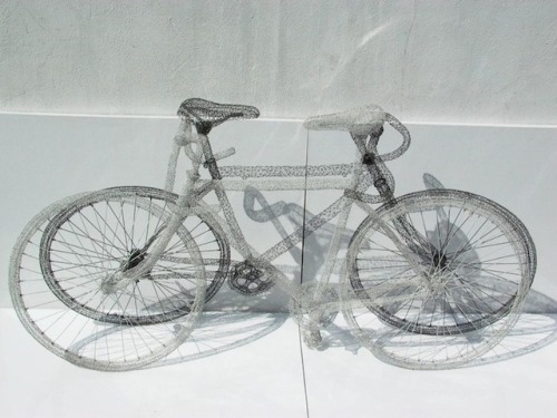 Artist Shi Jindian 师进滇 creates wire sculptures of transportation vehicles by wrapping steel wires ar