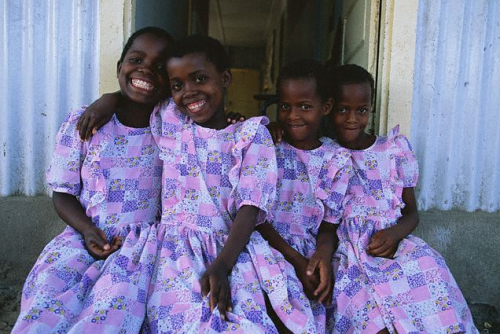 manufactoriel:Four girls with matching dresses, Mozambique, 1998, by Annie Griffiths Belt  &nbs