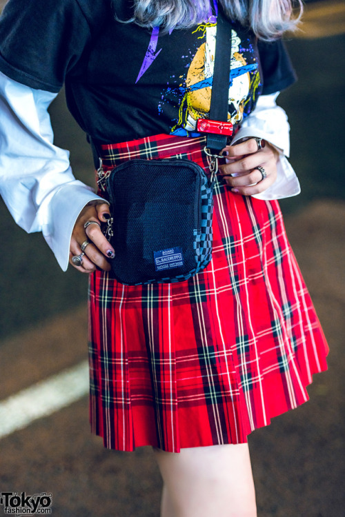 16-year-old Mawoni on the street in Harajuku wearing a Metallica t-shirt with a vintage plaid skirt,