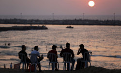 letswakeupworld:  Palestinians sit on the beach in Gaza City after a long term ceasefire took hold, hailed by Israel and Hamas as a victory to the fifty day war.