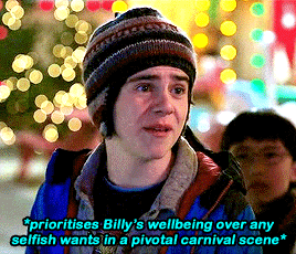 Gif. Freddy at the carnival where the movie's finale fight happens. He is begging Billy to walk away from the fight and not put himself in danger despite earlier having wanted him to be a hero, prioritizing Billy's wellbeing over any selfish needs. 