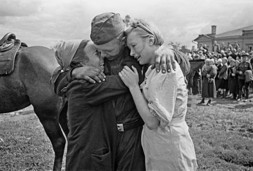 A Soviet soldier reunites with his sisters following the liberation of the Nazi-occupied city of Bry