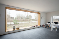 aros:  House with Built-In Window Nook and Interior Fire Pit