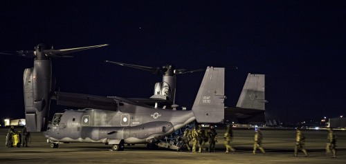 AC-130U Spooky and CV-22 Osprey A U.S. Air Force AC-130U Spooky Gunship from the 4th Special Operat