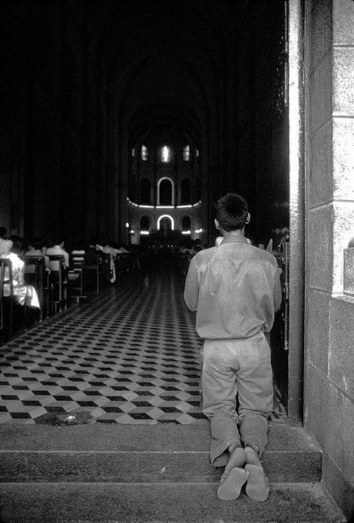 Saigon in May, 1975 - A bo doi, a soldier of the people&rsquo;s army, praying at Notre Dame Cathedra
