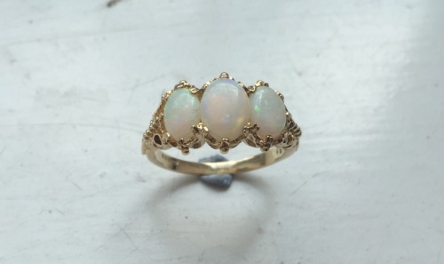 shawngalaxy:quartz-thorns:Beautiful gift from my father. Opals on a unique gold setting.Someone marr