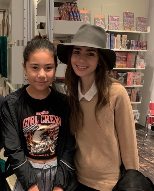 Lily Collins with a fan (sigrid.kleiven) at Victoria and Albert museum in London yesterday (Septembe