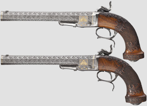 peashooter85:A pair of ornate percussion muzzleloading pistols manufactured by Husqvarna.  Formerly 