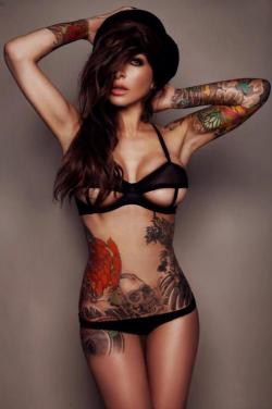 skinanink:  i love these tatts  She is sexy as hell!!!