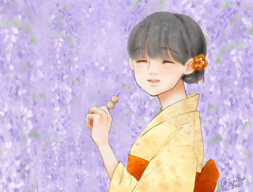 Fujisaki-san with fuji (wisteria) in the background.The kanji for the flower is also the one in her 
