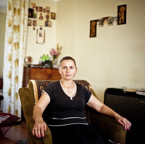Portrait of Natia Merabishvili, mother of Amalia and Georg in her home at the Tserovani IDP camp. 