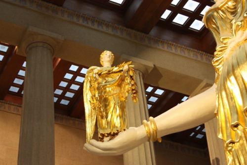 athena holding nike