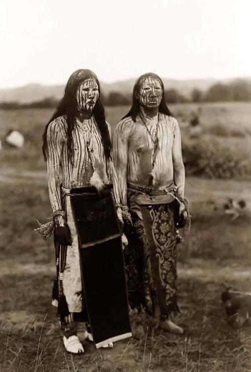 Two Cheyenne Indian men in ceremonial paint.Sun Dance Pledgers photographed in 1910 by Edward S. Cur