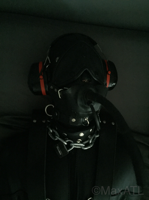 maxatl:  MASTER was resting and did not want to be disturbed, so he put his slave away for a couple of hours. He kept pumping the inflatable gag, however, so it wasn’t a peaceful rest…. Btw I think this pics are awesome. The leather is just so hot