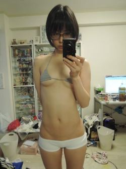 I like this skinny asian girl taking a sexy selfie of herself, she is wearing the hottest little bikini top which only just covers her tight little titties and a hot little pair of white panties that are tight and small showing off this sexy asian girls