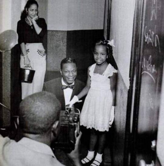 brothamanblack77:Maria Cole stands by patiently while husband, Nat King Cole poses with Singer Gladys Knight age 7, who meets her idol 1953 .