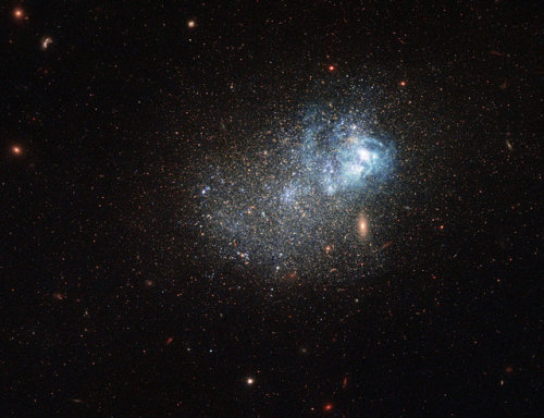 just–space:Hubble Sweeps a Messy Star Factory : This sprinkle of cosmic glitter is a blue comp