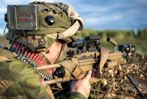 gunrunnerhell:  Red Rounds Norwegian soldier during the military exercise Saber Strike held in Latvia. His FN Minimi is loaded with plastic, red-colored blanks. They’re a bit cheaper to use than other blanks that use actual brass. It should be noted