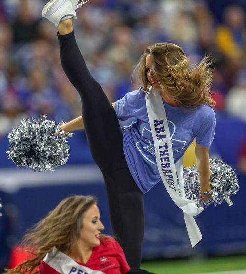 Image: Five memes made from a photograph of a cheerleader on a field, wearing a blue puzzle piece “a