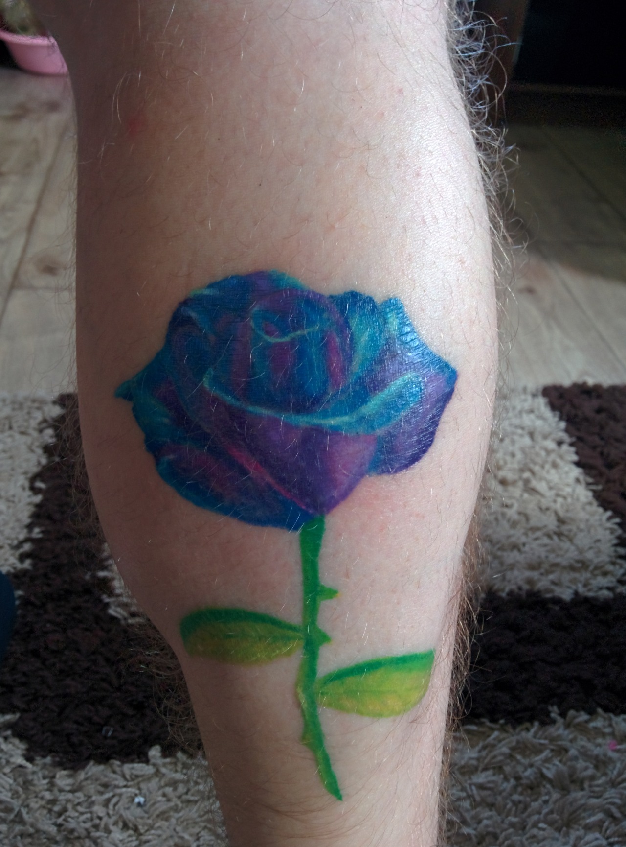Blue rose tattoo on Marks right hand done in Tahoe at