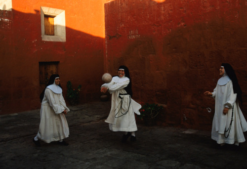 global-musings:Novice nuns play ball at the Santa Catalina MonestaryLocation: Arequipa, PeruPhotogra