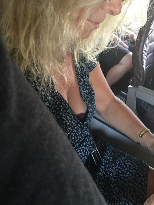 Check out the hot milf seated next to me on this flight. Great legs and nice lacy bra showing. What 