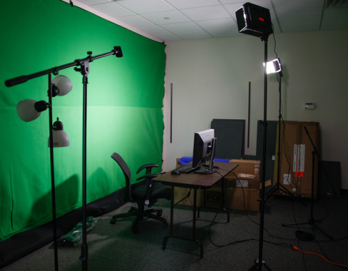 Our new streaming room is coming along; door is on, greenscreen is up, a whole mess of new gear is g