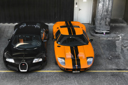 topvehicles:  Black Bugatti Veyron beside