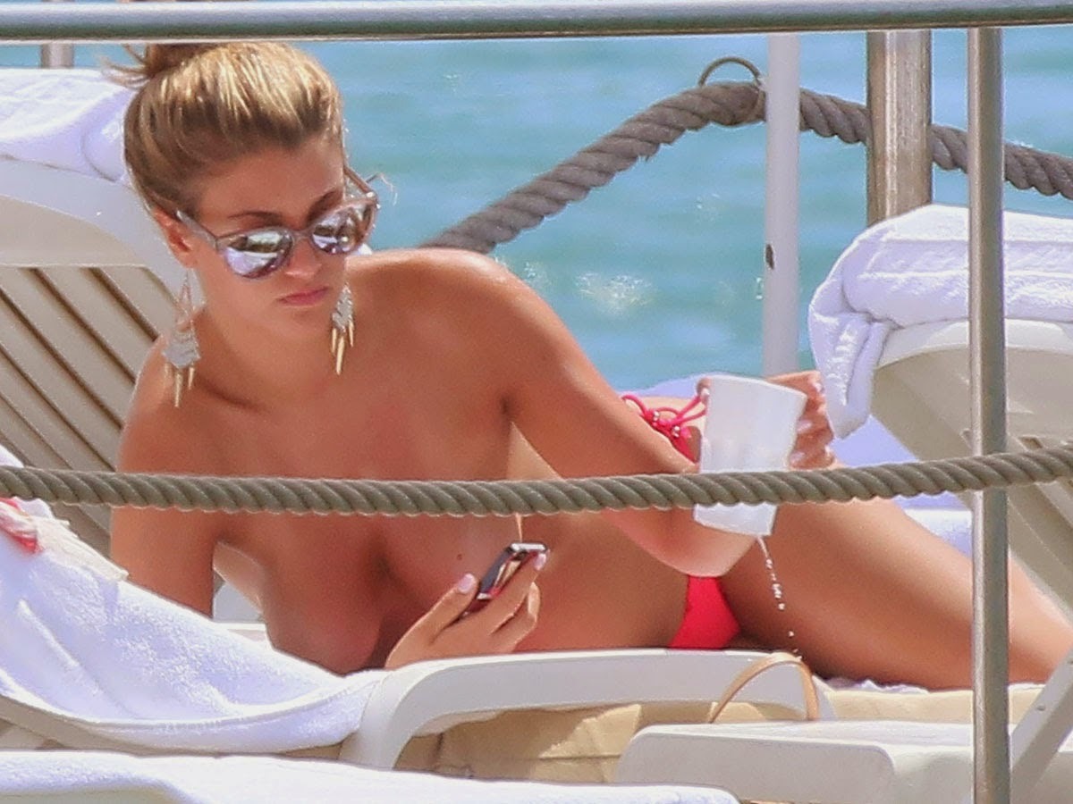 toplessbeachcelebs:Amy WillertonÂ sunbathing topless in CannesÂ (August 2014)