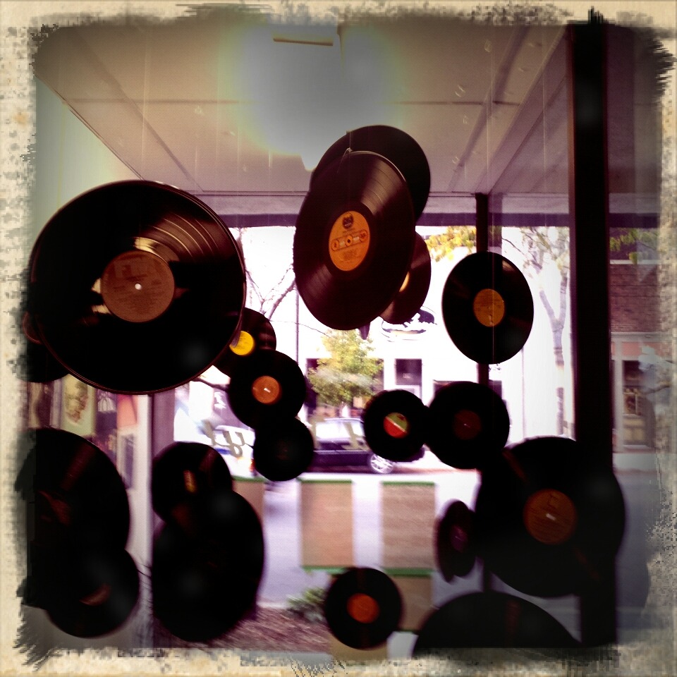 supervinylwonderland:  blurry shot.front window of the shop.. 