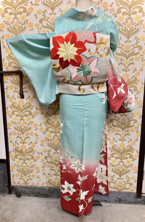 Rare antique summer houmongi, with a beautiful red to turquoise bokashi (gradient), depicting radian