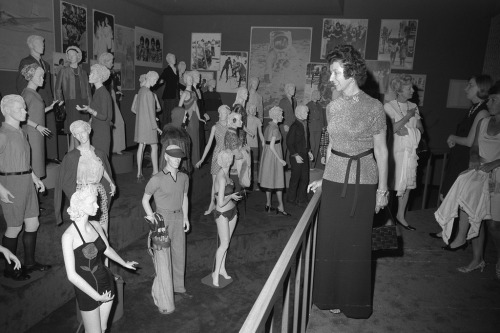 Opening night visitors view a parade of recent fashions in the &ldquo;Suiting Everyone&rdquo
