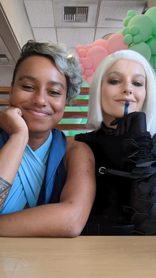 Arm wrestling for the bill in goth girl IHOP.
