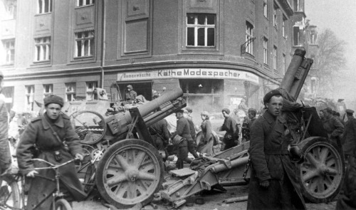 bag-of-dirt - Soviet soldiers march past two destroyed German...